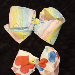 2 medium size salon quality little girls heart bows